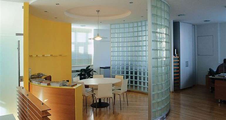 Curved glass block walls dividing a contemporary interior